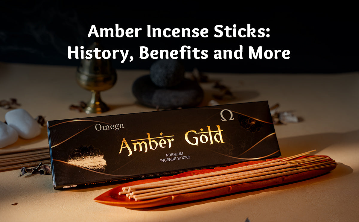 Amber Gold incense sticks in a holder with stones and incense box, promoting relaxation.