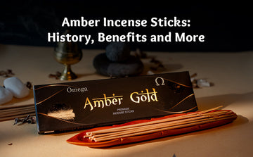 Amber Gold incense sticks in a holder with stones and incense box, promoting relaxation.