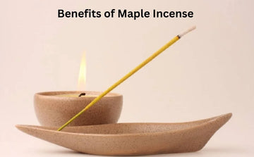 Maple incense stick burning in a ceramic holder with candle and benefits text above
