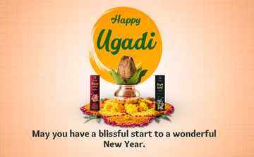 Happy Ugadi greeting with coconut kalash, incense sticks, and marigold flower rangoli